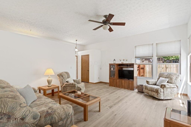 8000 Leaview Dr, Columbus, OH 43235 - living room with a textured ceiling, light wood-type flooring, and a ceiling fan