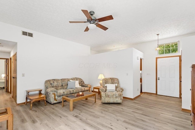 8000 Leaview Dr, Columbus, OH 43235 - living area with light wood-style flooring, ceiling fan, and a textured ceiling