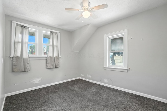 668 Bulen Ave, Columbus, OH 43205 - unfurnished room featuring dark carpet, ceiling fan, and a textured ceiling