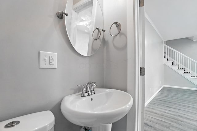 668 Bulen Ave, Columbus, OH 43205 - half bath with a sink and wood finished floors