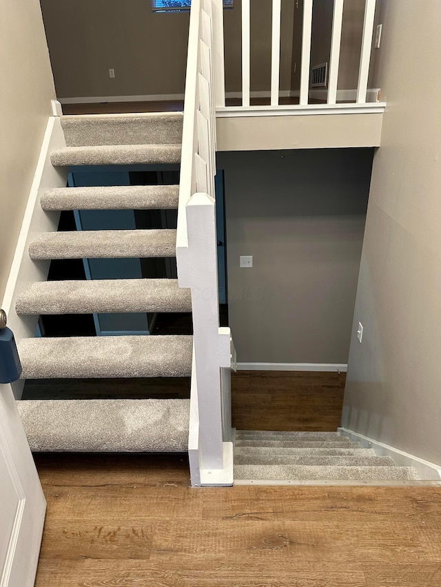 3251 Foxpoint Dr, Hilliard, OH 43026 - staircase with wood finished floors and baseboards