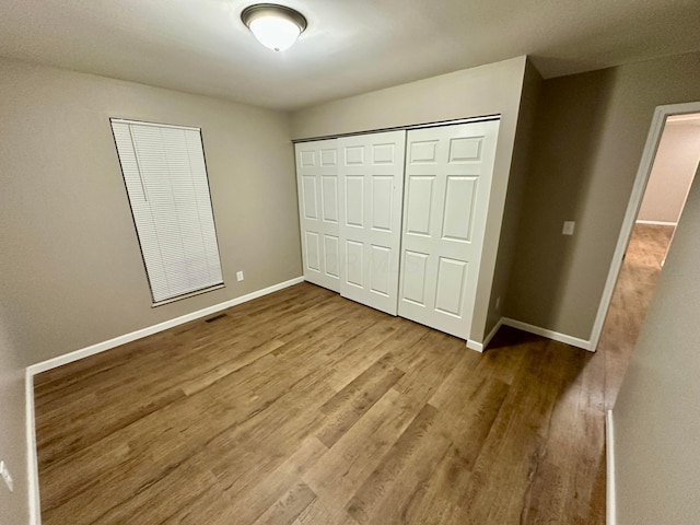3251 Foxpoint Dr, Hilliard, OH 43026 - unfurnished bedroom featuring wood finished floors and a closet