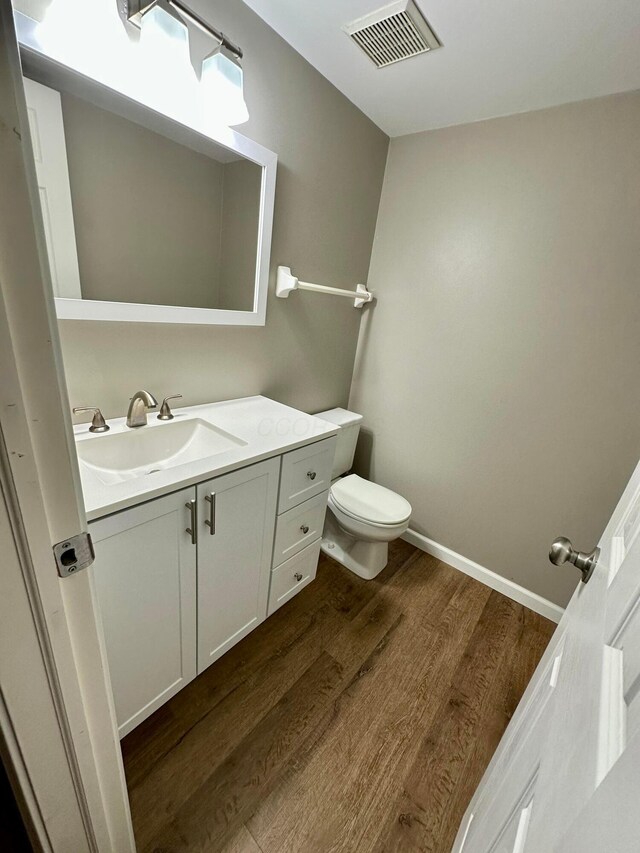 3251 Foxpoint Dr, Hilliard, OH 43026 - half bathroom with wood finished floors and vanity