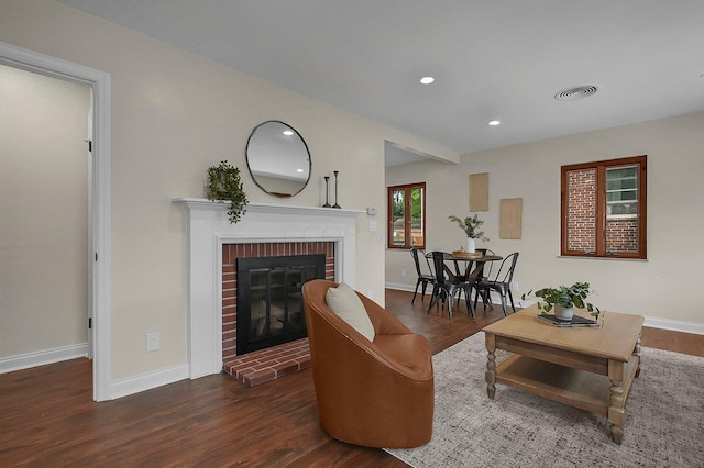 2850 E Moreland Dr, Columbus, OH 43209 - living area featuring a brick fireplace, wood finished floors, and recessed lighting
