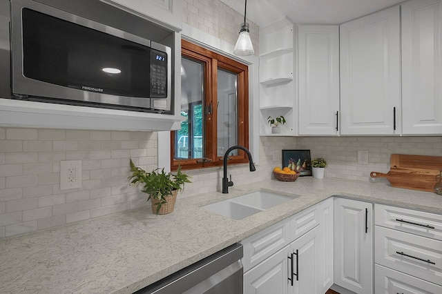 2850 E Moreland Dr, Columbus, OH 43209 - kitchen featuring appliances with stainless steel finishes, tasteful backsplash, white cabinets, open shelves, and light stone counters
