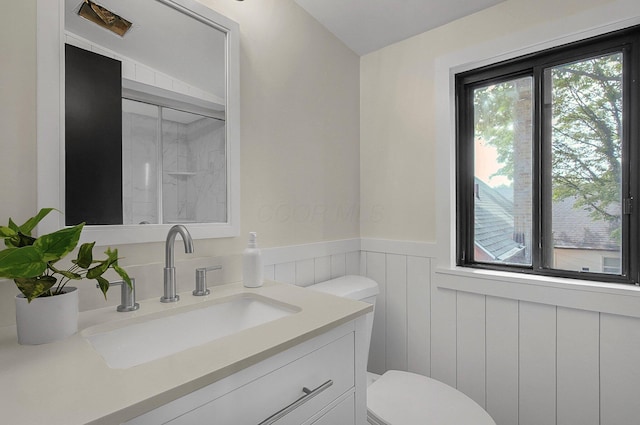 2850 E Moreland Dr, Columbus, OH 43209 - bathroom with a shower with shower door, wainscoting, and vanity