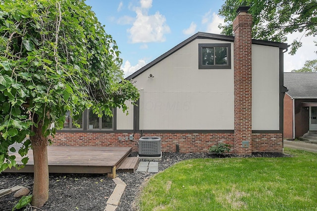 2850 E Moreland Dr, Columbus, OH 43209 - back of house with a chimney, a lawn, and a wooden deck