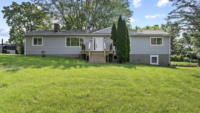 8149 Outville Rd SW, Pataskala, OH 43062 - back of house featuring a chimney, a yard, and a wooden deck