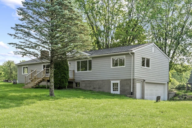 8149 Outville Rd SW, Pataskala, OH 43062 - rear view of house featuring an attached garage, stairway, a chimney, a yard, and a wooden deck
