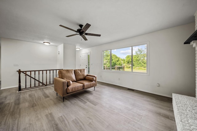 8149 Outville Rd SW, Pataskala, OH 43062 - living area with an upstairs landing, a ceiling fan, and wood finished floors