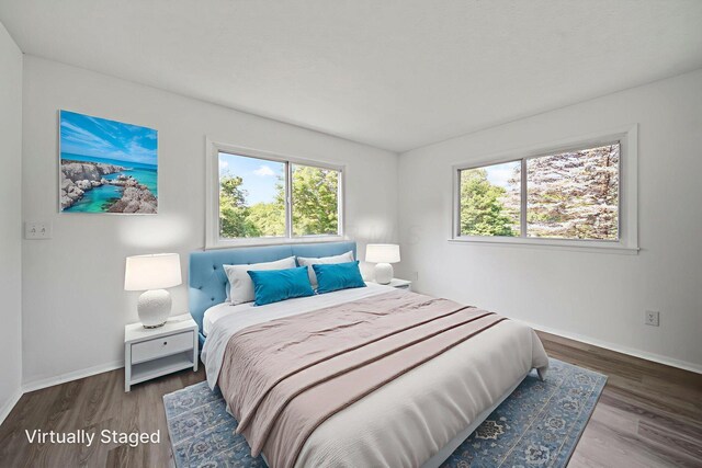 8149 Outville Rd SW, Pataskala, OH 43062 - bedroom featuring multiple windows and wood finished floors