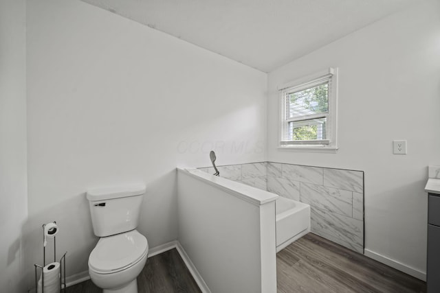 8149 Outville Rd SW, Pataskala, OH 43062 - bathroom with wood finished floors, a garden tub, and vanity