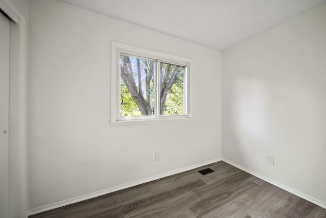 8149 Outville Rd SW, Pataskala, OH 43062 - unfurnished room featuring dark wood-style floors and baseboards