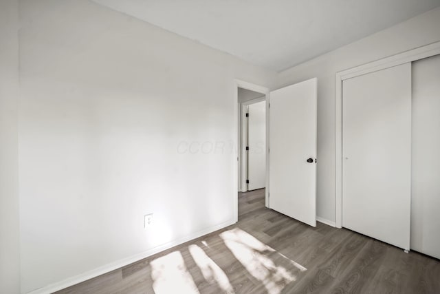 8149 Outville Rd SW, Pataskala, OH 43062 - unfurnished bedroom with wood finished floors and a closet