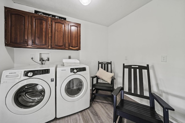 8149 Outville Rd SW, Pataskala, OH 43062 - laundry area featuring cabinet space, independent washer and dryer, and light wood-type flooring