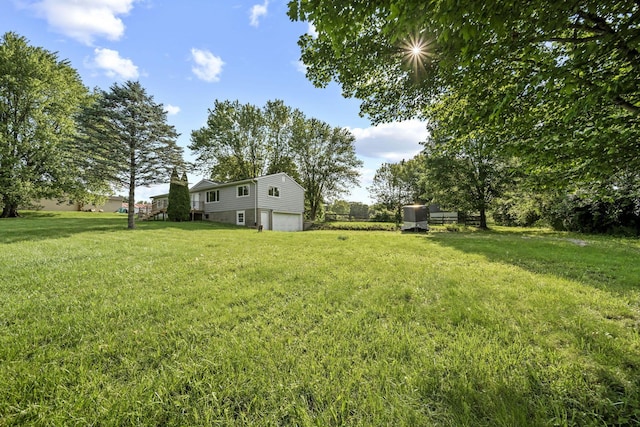 8149 Outville Rd SW, Pataskala, OH 43062 - view of grassy yard with an attached garage