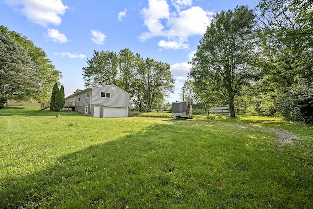 8149 Outville Rd SW, Pataskala, OH 43062 - view of green lawn with a garage