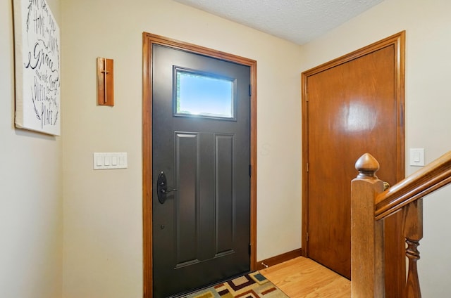 3383 Parkbrook Dr, Grove City, OH 43123 - entryway with light wood-type flooring and a textured ceiling