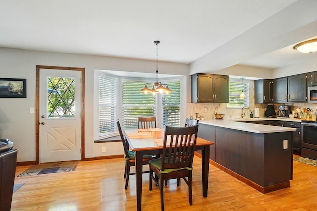 3383 Parkbrook Dr, Grove City, OH 43123 - dining space with light wood finished floors and a chandelier