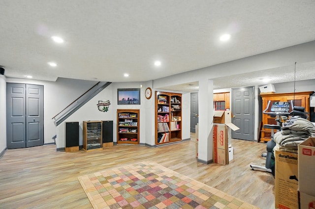 3383 Parkbrook Dr, Grove City, OH 43123 - workout area featuring light wood-type flooring, recessed lighting, and a textured ceiling