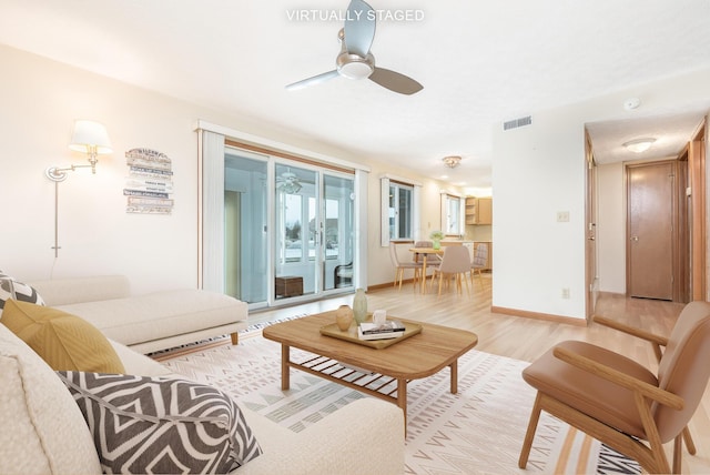 129 Chase Ave Unit 102L, Russells Point, OH 43348 - living area with light wood-style floors and ceiling fan