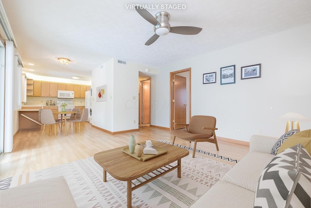 129 Chase Ave Unit 102L, Russells Point, OH 43348 - living area with light wood-style flooring and a ceiling fan