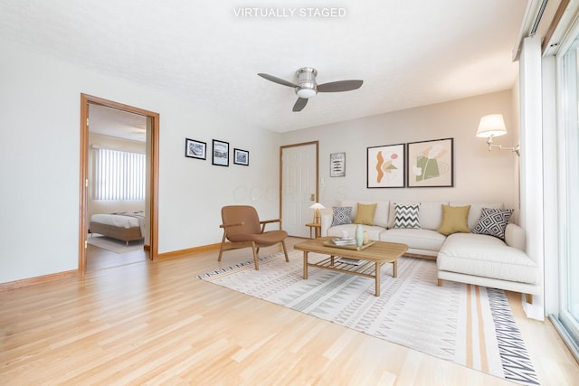 129 Chase Ave Unit 102L, Russells Point, OH 43348 - living room featuring wood finished floors and a ceiling fan