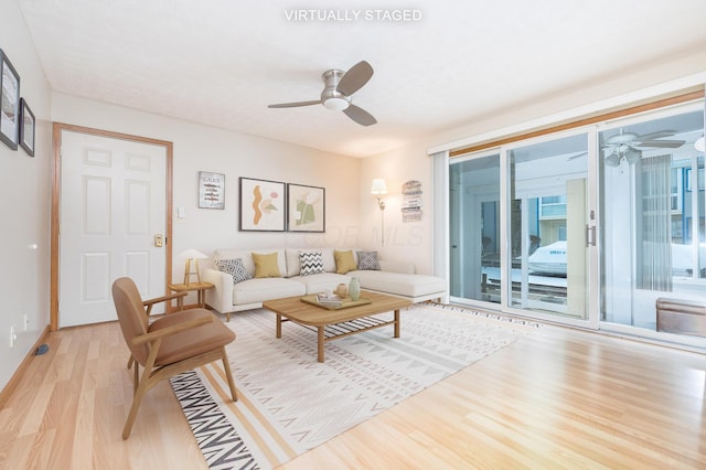 129 Chase Ave Unit 102L, Russells Point, OH 43348 - living room with wood finished floors and a ceiling fan