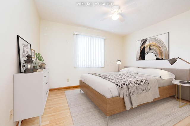 129 Chase Ave Unit 102L, Russells Point, OH 43348 - bedroom with light wood finished floors and a ceiling fan