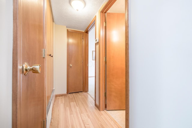 129 Chase Ave Unit 102L, Russells Point, OH 43348 - corridor with light wood-style floors and a textured ceiling