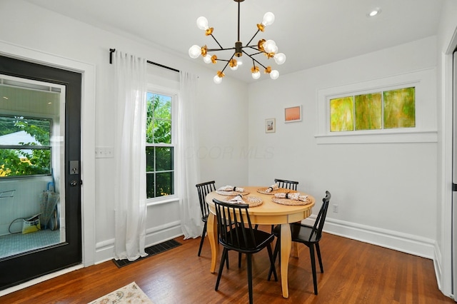 484 Sheldon Ave, Columbus, OH 43207 - dining room featuring a chandelier and dark wood-style flooring