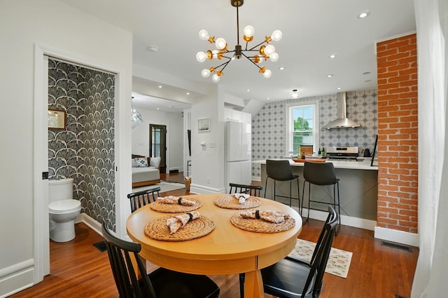 484 Sheldon Ave, Columbus, OH 43207 - dining area featuring wood finished floors, a chandelier, and recessed lighting