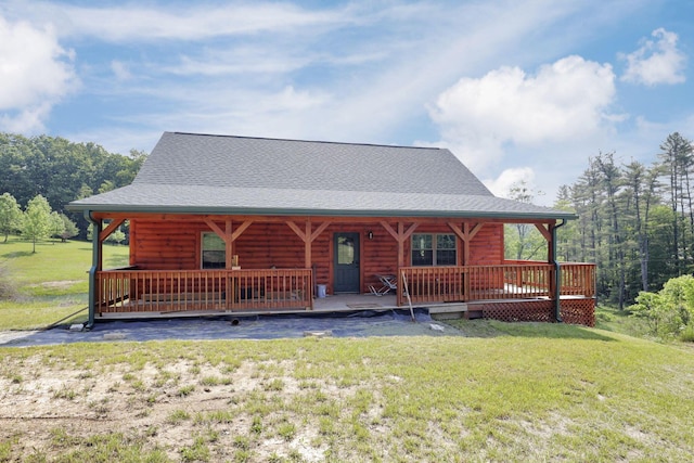 35640 Vickers Rd, Logan, OH 43138 - view of front facade featuring a front yard, covered porch, a shingled roof, and log veneer siding