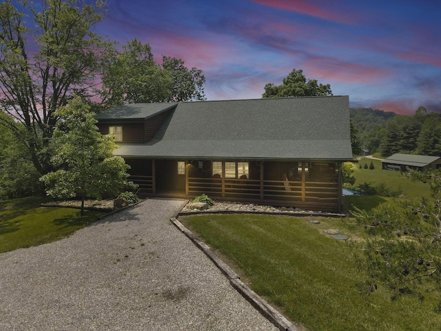 35640 Vickers Rd, Logan, OH 43138 - cabin with covered porch, driveway, and a lawn