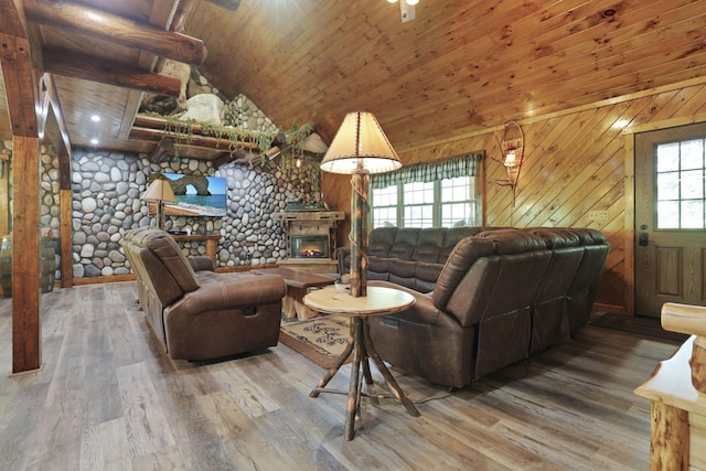 35640 Vickers Rd, Logan, OH 43138 - living area featuring wood finished floors, wooden ceiling, a fireplace, wood walls, and high vaulted ceiling