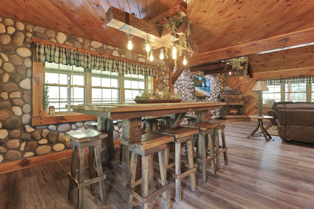 35640 Vickers Rd, Logan, OH 43138 - dining space featuring wood ceiling, wood finished floors, a chandelier, and a lit fireplace