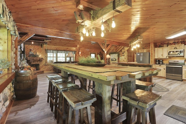 35640 Vickers Rd, Logan, OH 43138 - dining space featuring wood walls, wood ceiling, light wood finished floors, and a chandelier