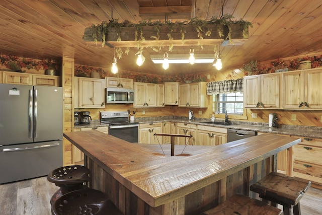 35640 Vickers Rd, Logan, OH 43138 - kitchen with stainless steel appliances, wood ceiling, light wood-style flooring, wood counters, and light brown cabinets
