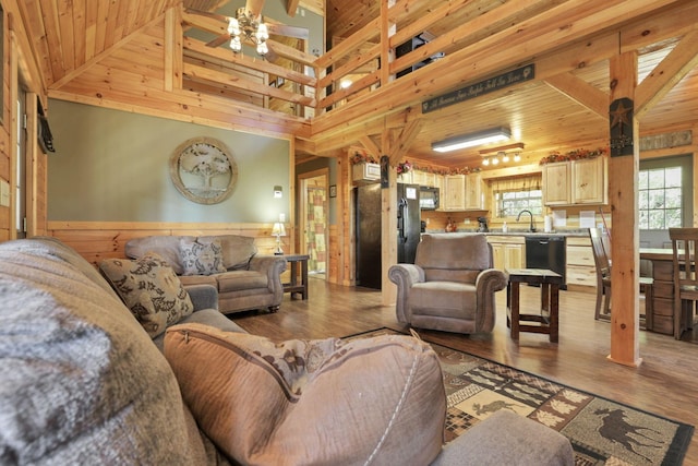 35640 Vickers Rd, Logan, OH 43138 - living area featuring wooden ceiling, light wood finished floors, ceiling fan, and wood walls