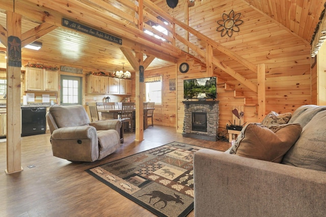 35640 Vickers Rd, Logan, OH 43138 - living room with wood ceiling, wood walls, a chandelier, vaulted ceiling, and wood finished floors
