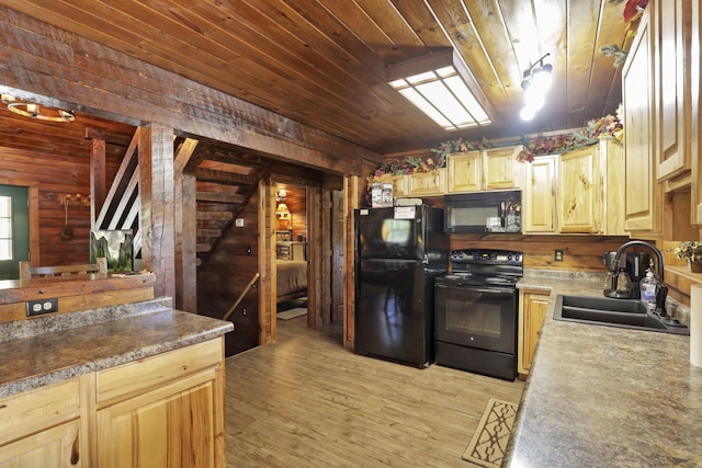 35640 Vickers Rd, Logan, OH 43138 - kitchen with black appliances, wooden walls, light wood-style flooring, wood ceiling, and light brown cabinets