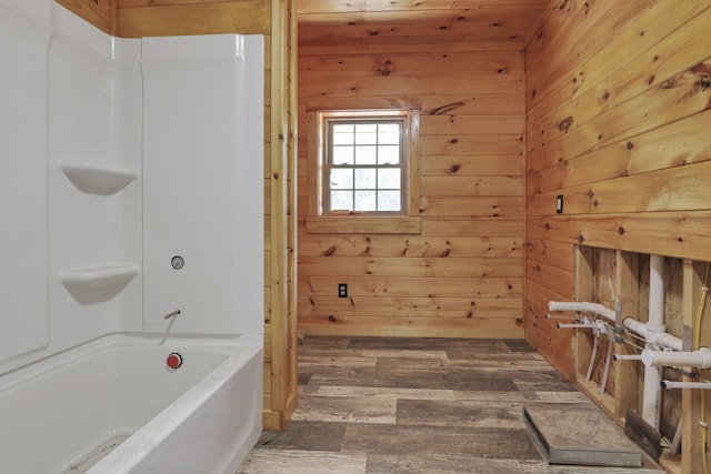 35640 Vickers Rd, Logan, OH 43138 - full bath featuring wood walls, hardwood / wood-style floors, and shower / bath combination