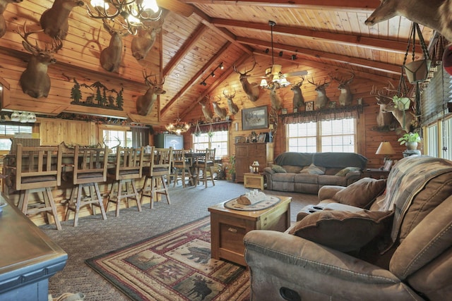 35640 Vickers Rd, Logan, OH 43138 - living room with a chandelier, carpet floors, a wood ceiling with exposed beams, wood walls, and high vaulted ceiling