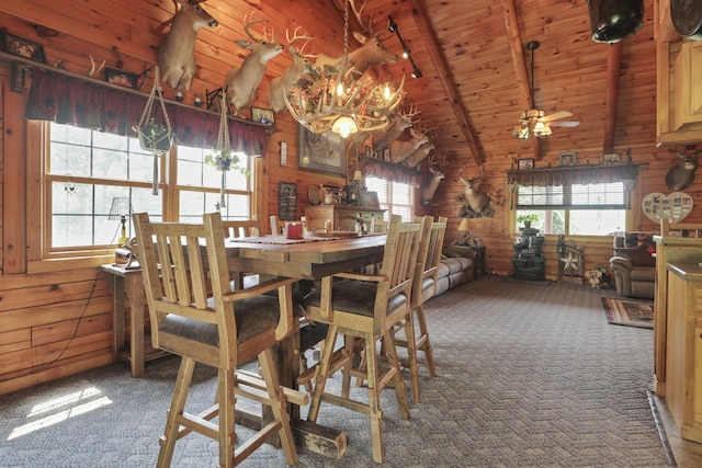 35640 Vickers Rd, Logan, OH 43138 - dining space featuring carpet flooring, wooden walls, wooden ceiling, and a chandelier