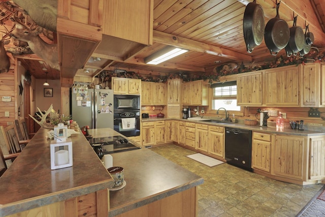 35640 Vickers Rd, Logan, OH 43138 - kitchen with black appliances, light brown cabinets, a large island, and a wood ceiling with exposed beams