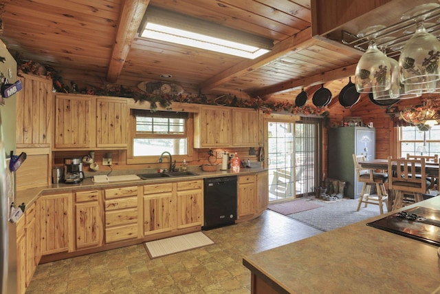 35640 Vickers Rd, Logan, OH 43138 - kitchen with black dishwasher, a wooden ceiling with exposed beams, light brown cabinets, light countertops, and wooden walls