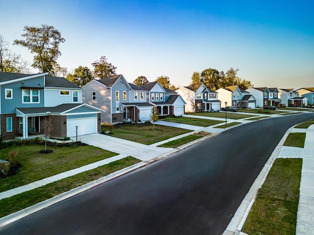 1238 Heathgate Way, Fairborn, OH 45324 - view of asphalt road featuring a residential view, sidewalks, and curbs