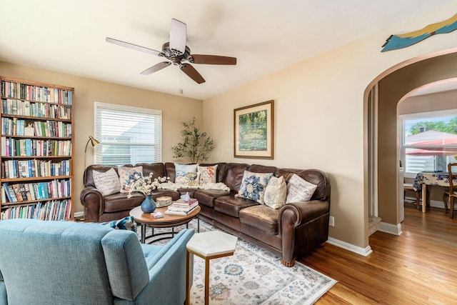 366 E Jeffrey Pl, Columbus, OH 43214 - living room featuring arched walkways, wood finished floors, and ceiling fan