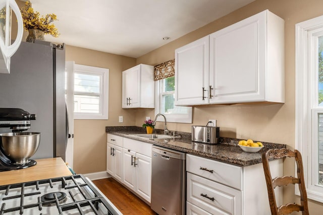 366 E Jeffrey Pl, Columbus, OH 43214 - kitchen with stainless steel appliances, white cabinetry, and healthy amount of natural light