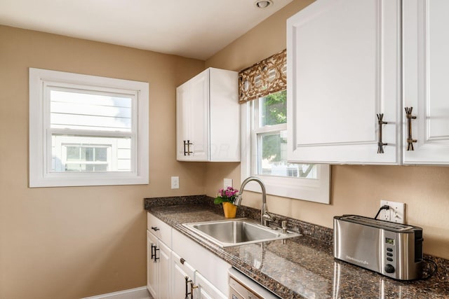 366 E Jeffrey Pl, Columbus, OH 43214 - kitchen with dark countertops and white cabinetry